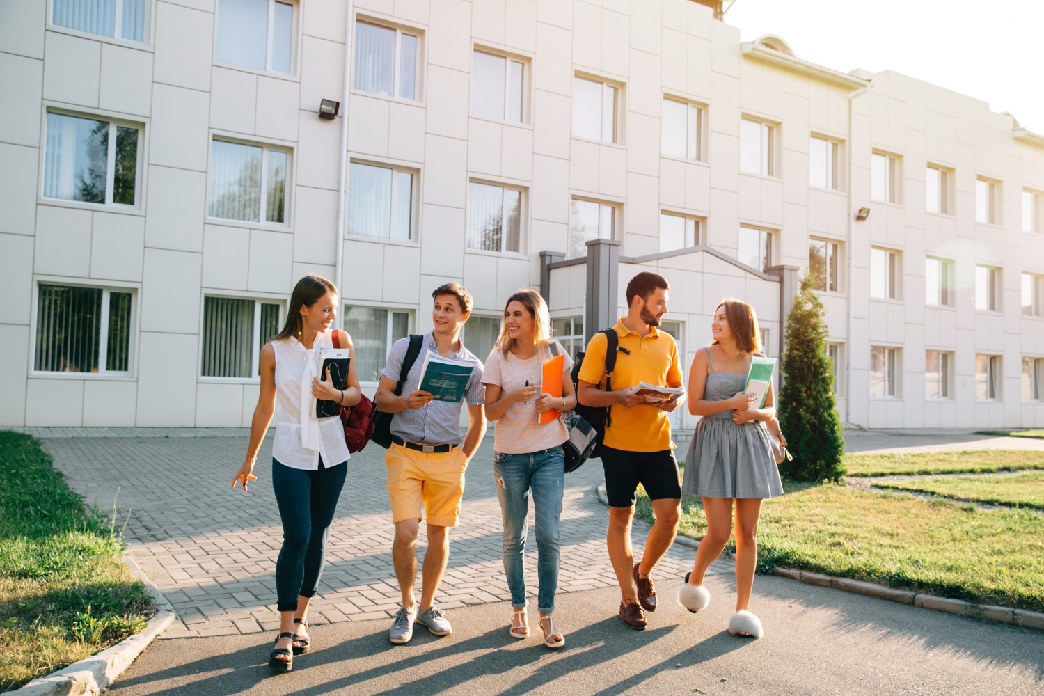 Diverse students walking together on a university campus