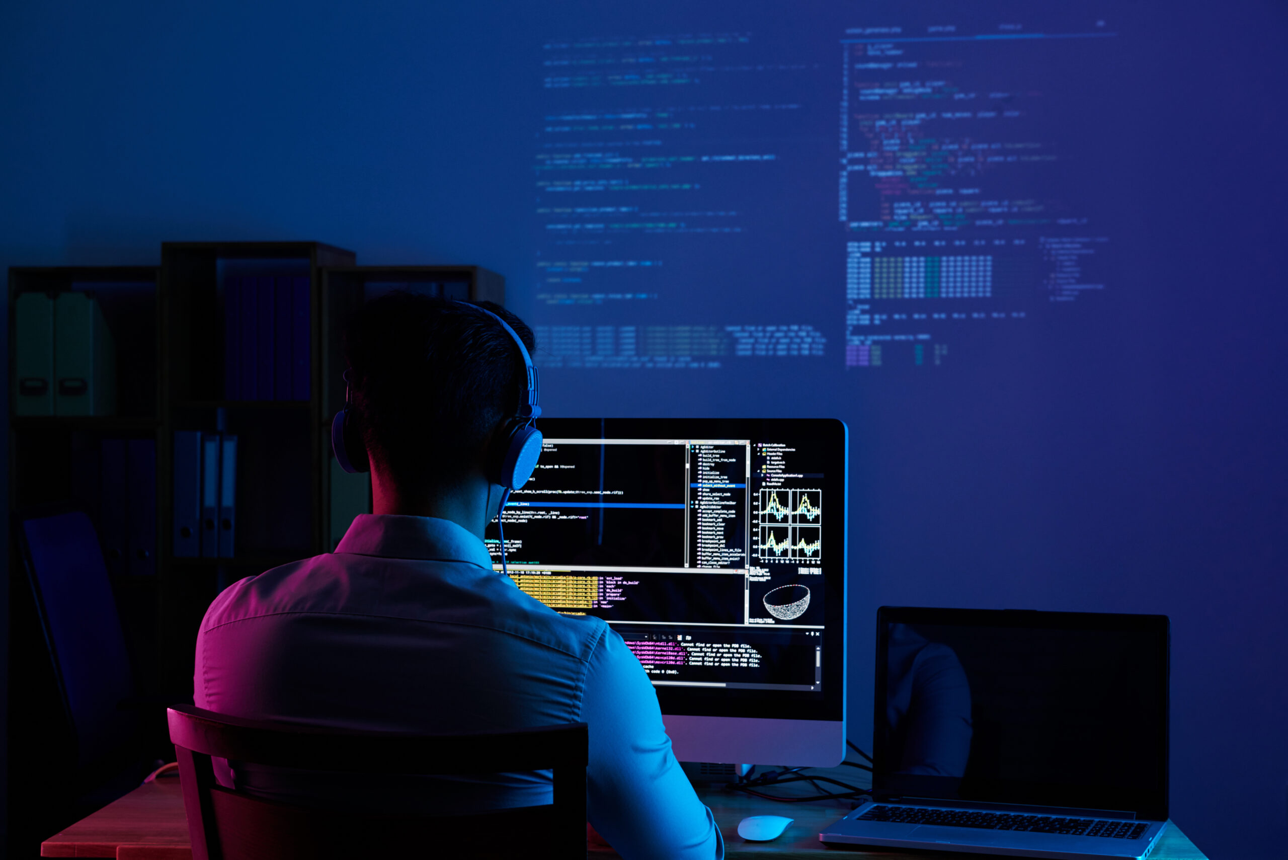 Programmer working with digital technology